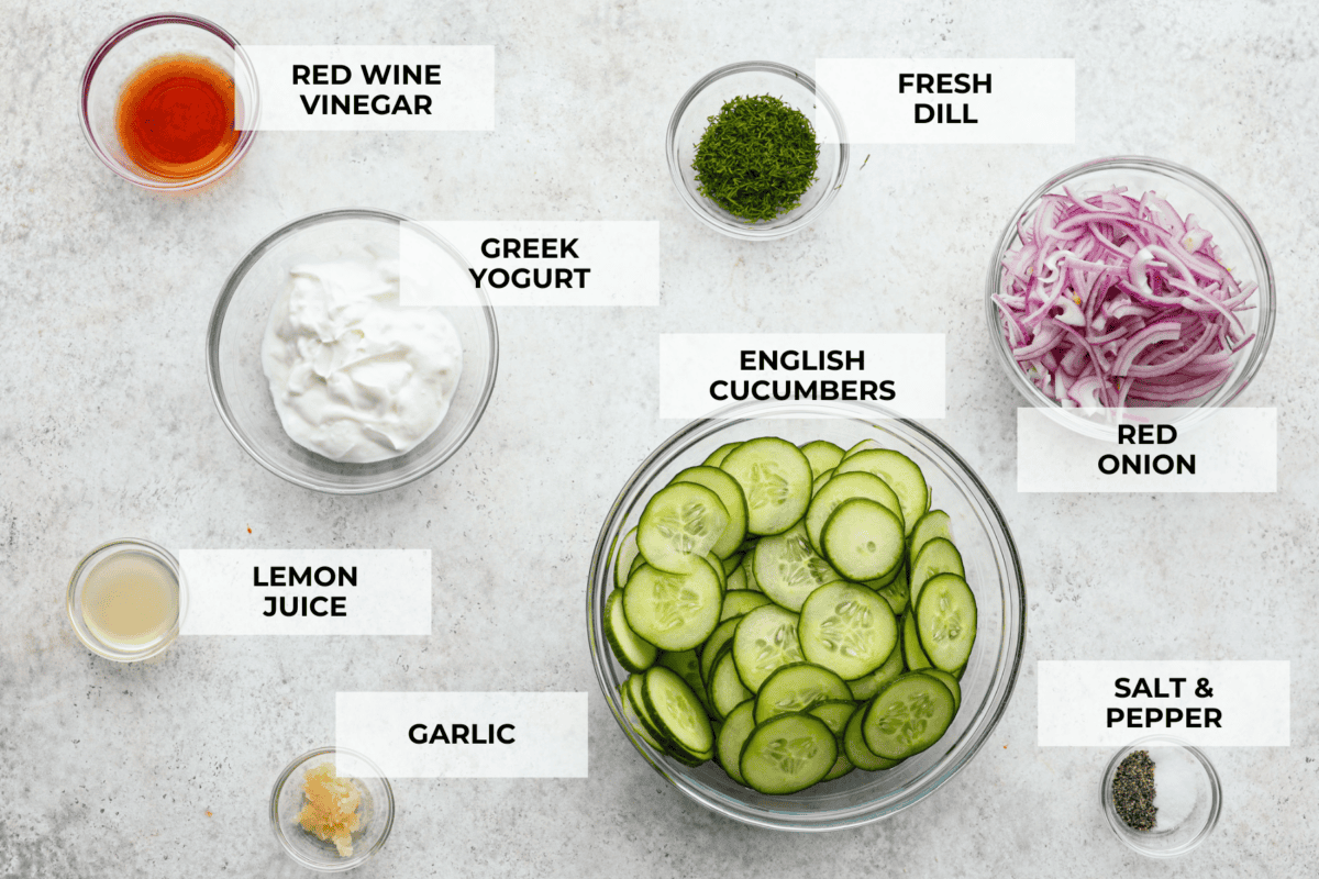 The top view of ingredients in individual glass bowls laid out on a counter and labeled. 