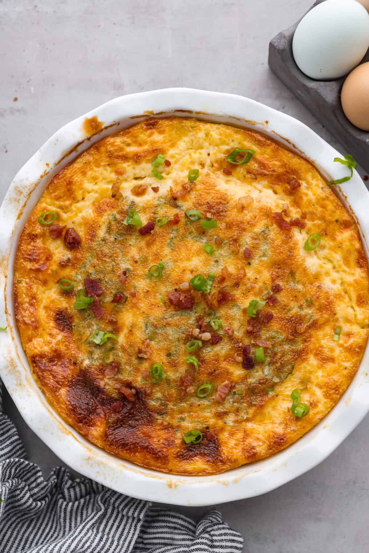 Top-down view of a baked crustless quiche.