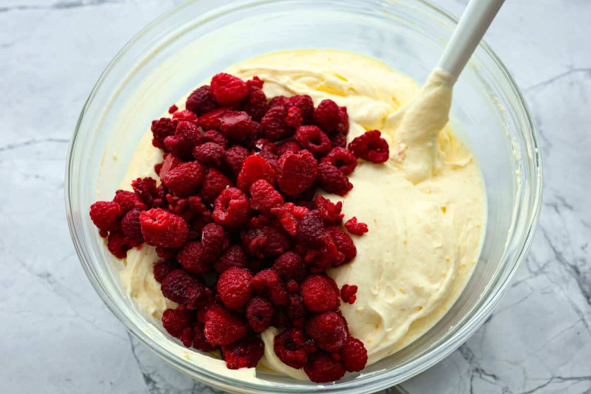 Raspberries added to the raspberry fluff salad mixture. 