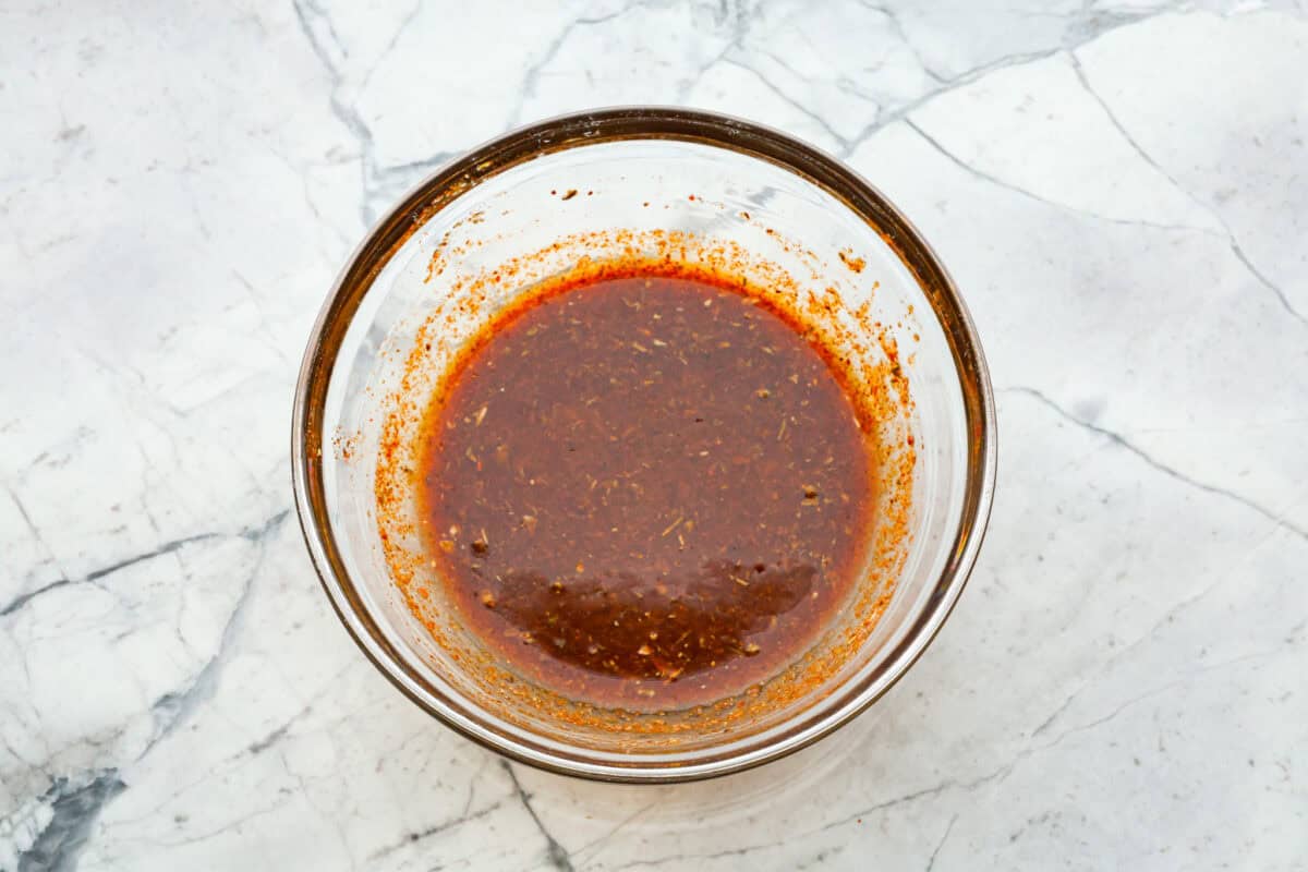 Overhead shot os mixed sauce ingredients in glass bowl. 