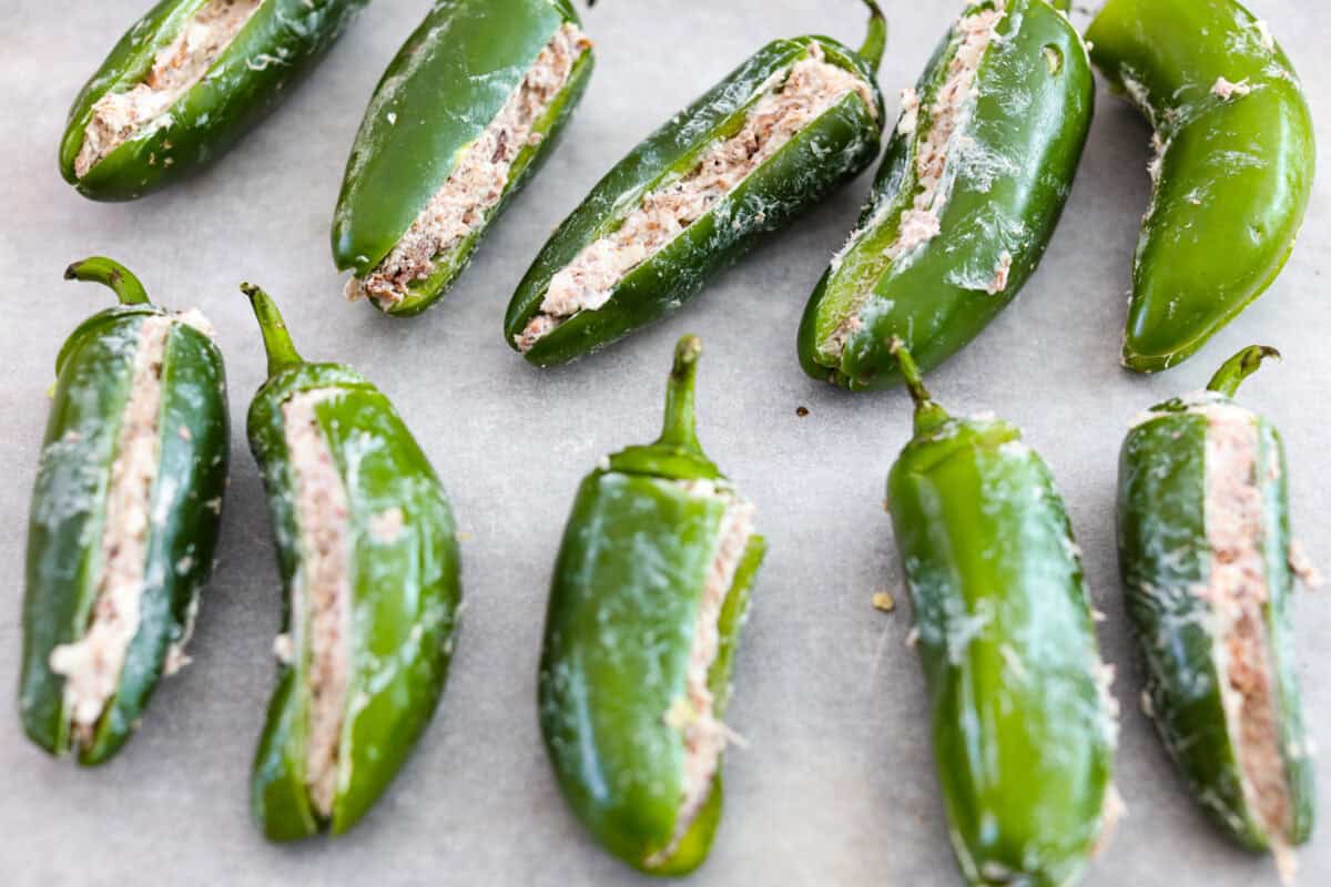 Overhead shot of stuffed jalapeños. 