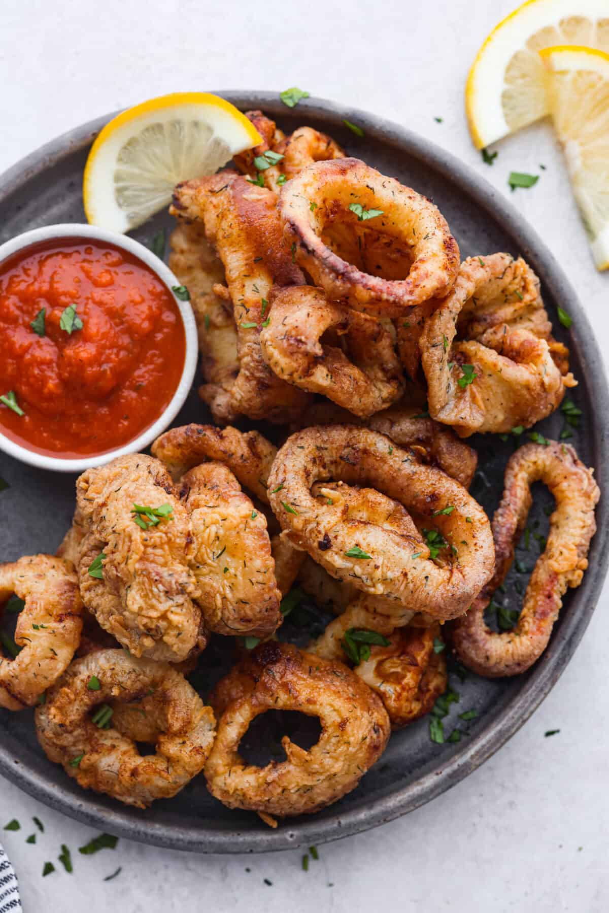 Overhead shot of fried calamari on a plate.