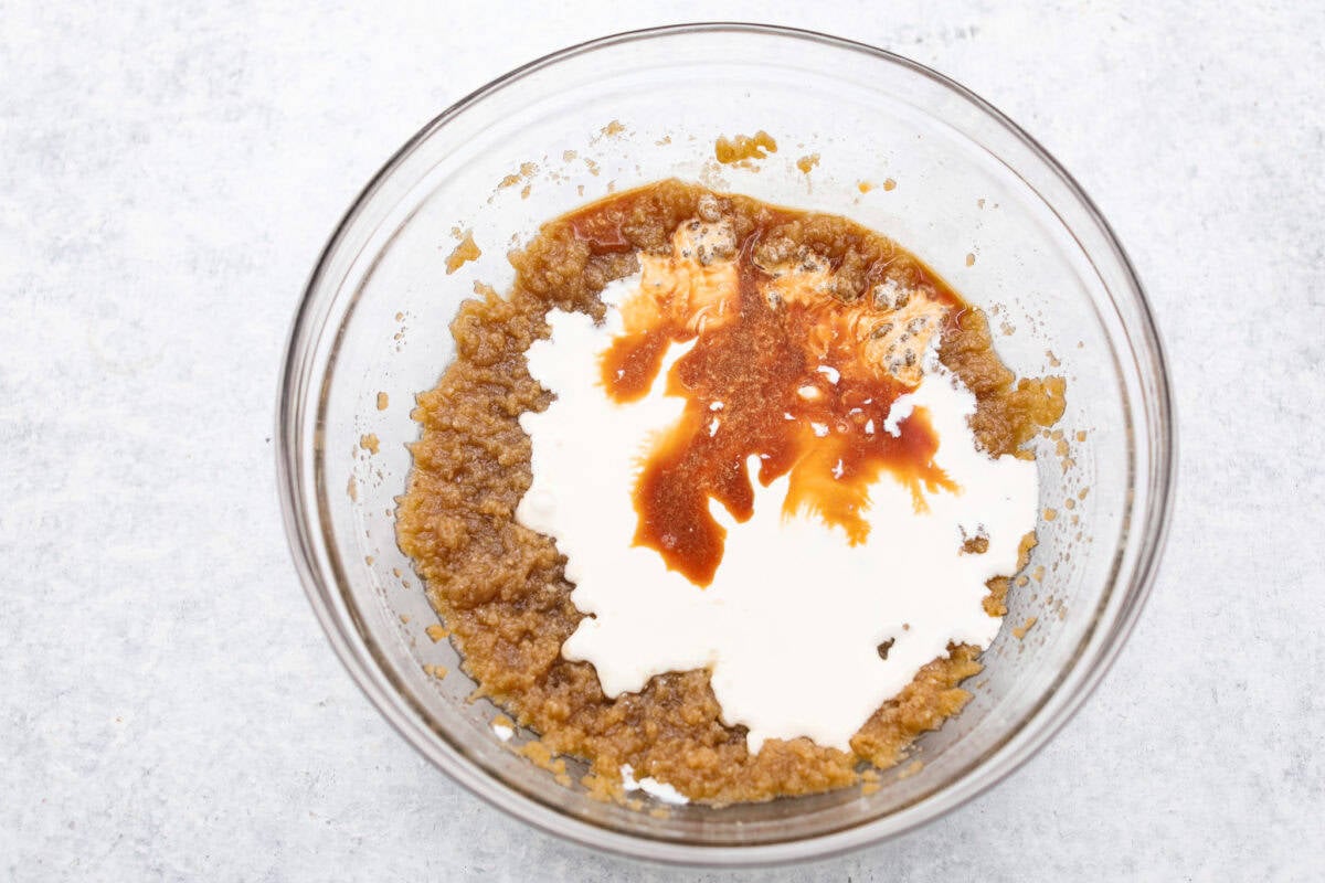 Overhead shot of the sugar and butter mixture with cream and vanilla. 