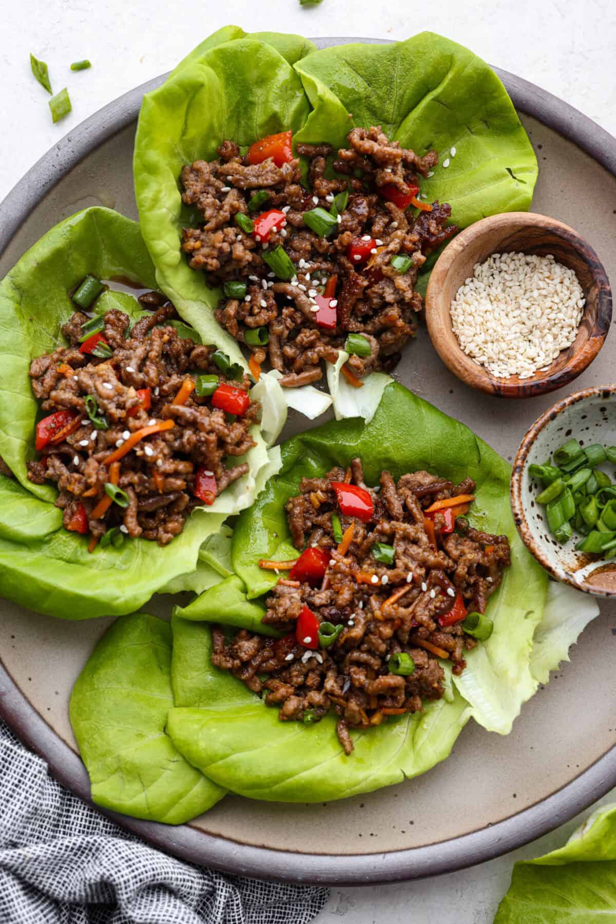 Overhead shot of Korean beef lettuce wraps on a serving platter. 