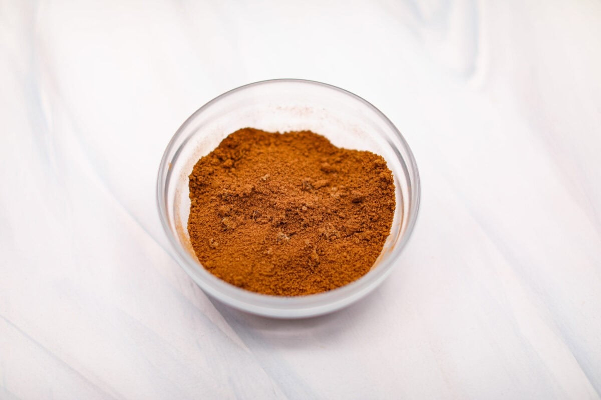 Overhead shot of cinnamon and brown sugar mixed in a bowl. 