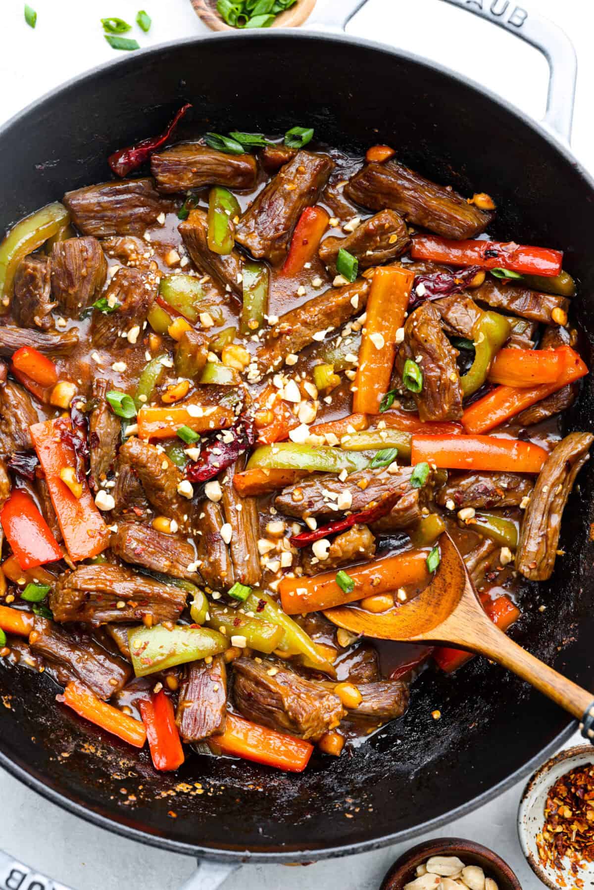 Overhead shot of Kung Pao Beef cooked in a wok. 