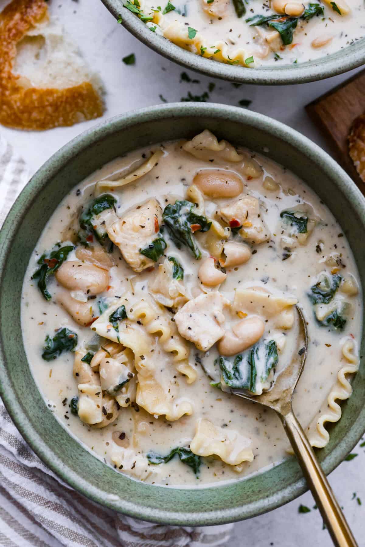 Overhead shot of a bowl of white lasagna soup.