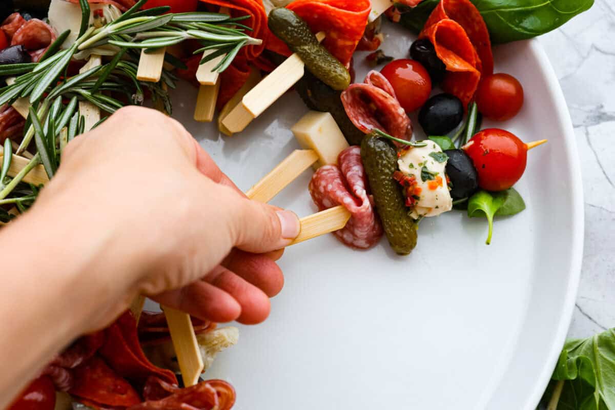 Third photo of arranging and shaping the antipasto charcuterie wreath.