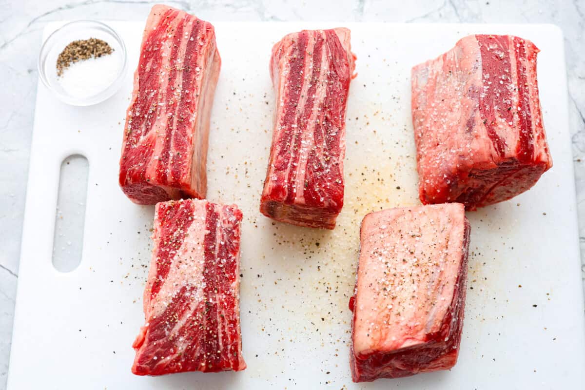 First photo of the short ribs seasoned with salt and pepper.