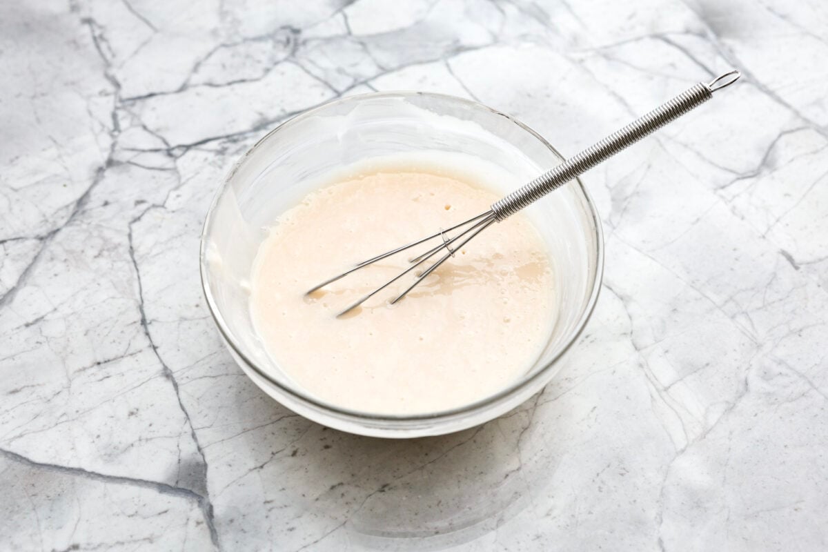 Overhead shot of the glaze ingredients whisked together in a bowl.