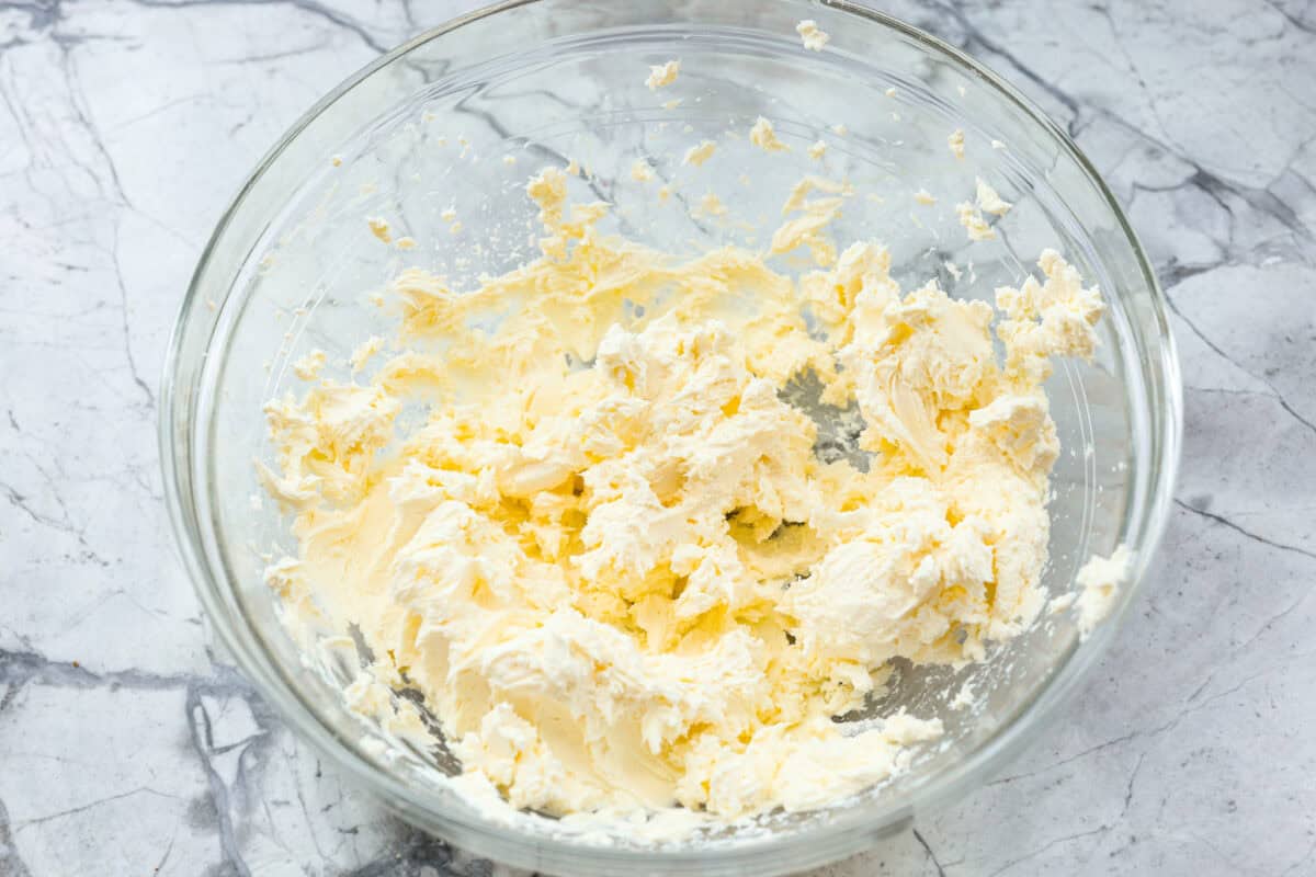 First photo of the cream cheese and seasonings mixed together in a mixing bowl.