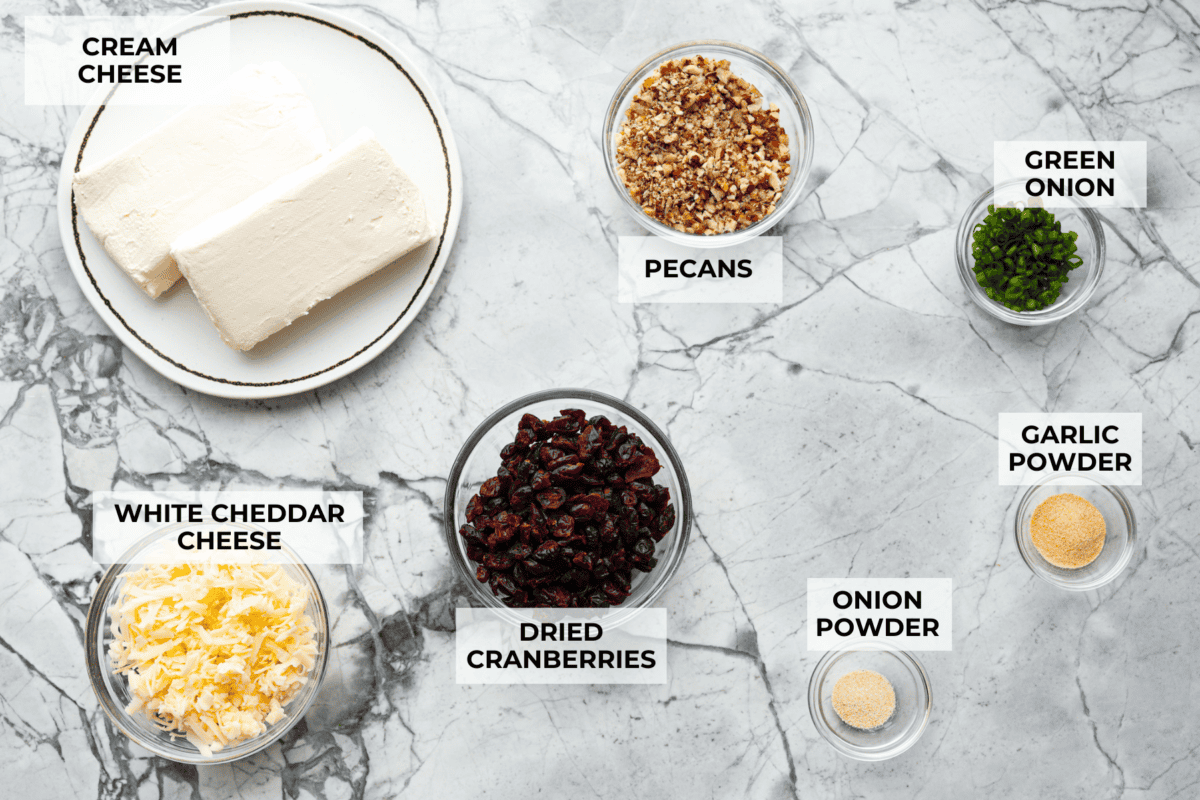 Ingredients labeled and pictured to make cranberry pecan cheese ball.