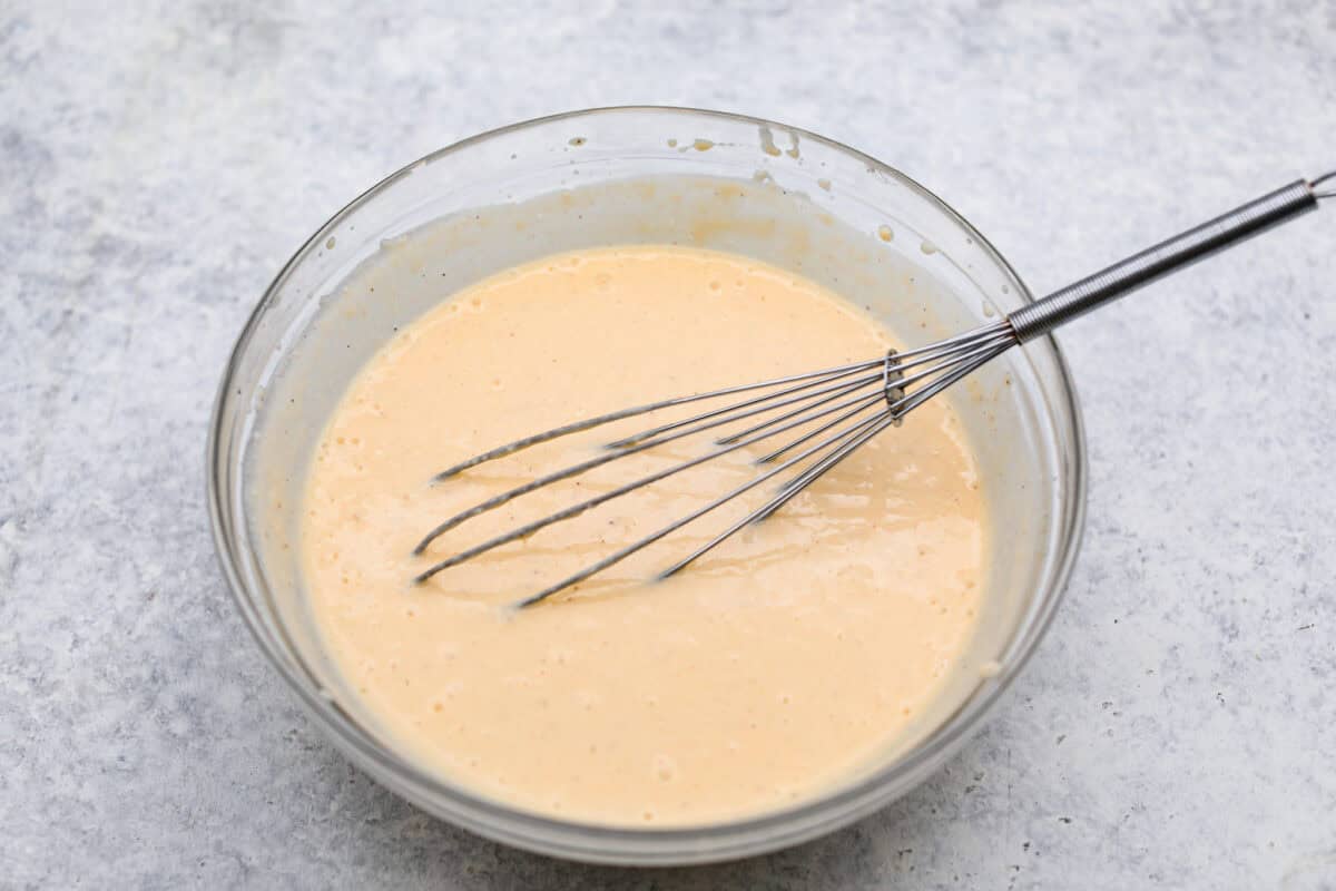 Overhead shot of topping ingredients whisked together in a bowl. 