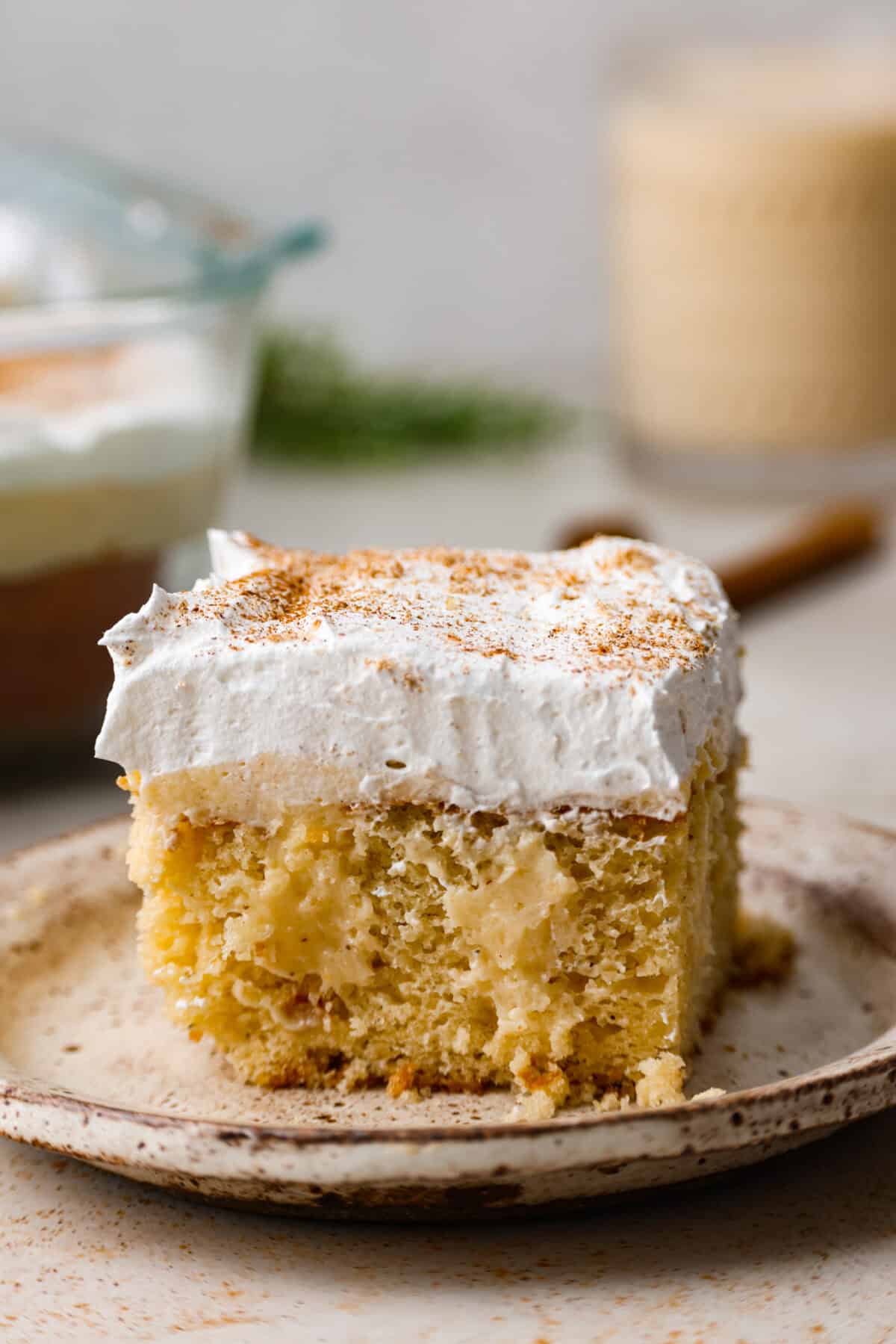 Side shot of plated eggnog poke cake. 