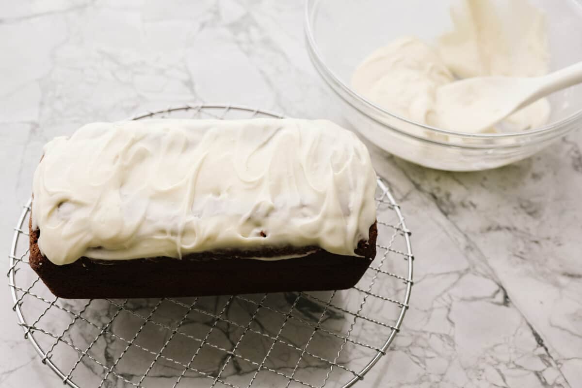 Overhead shot of the frosting spread over the top of the loaf. 