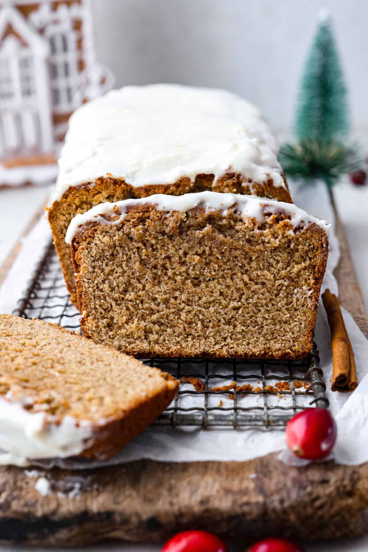 Side shot of a gingerbread loaf with slices taken out. 