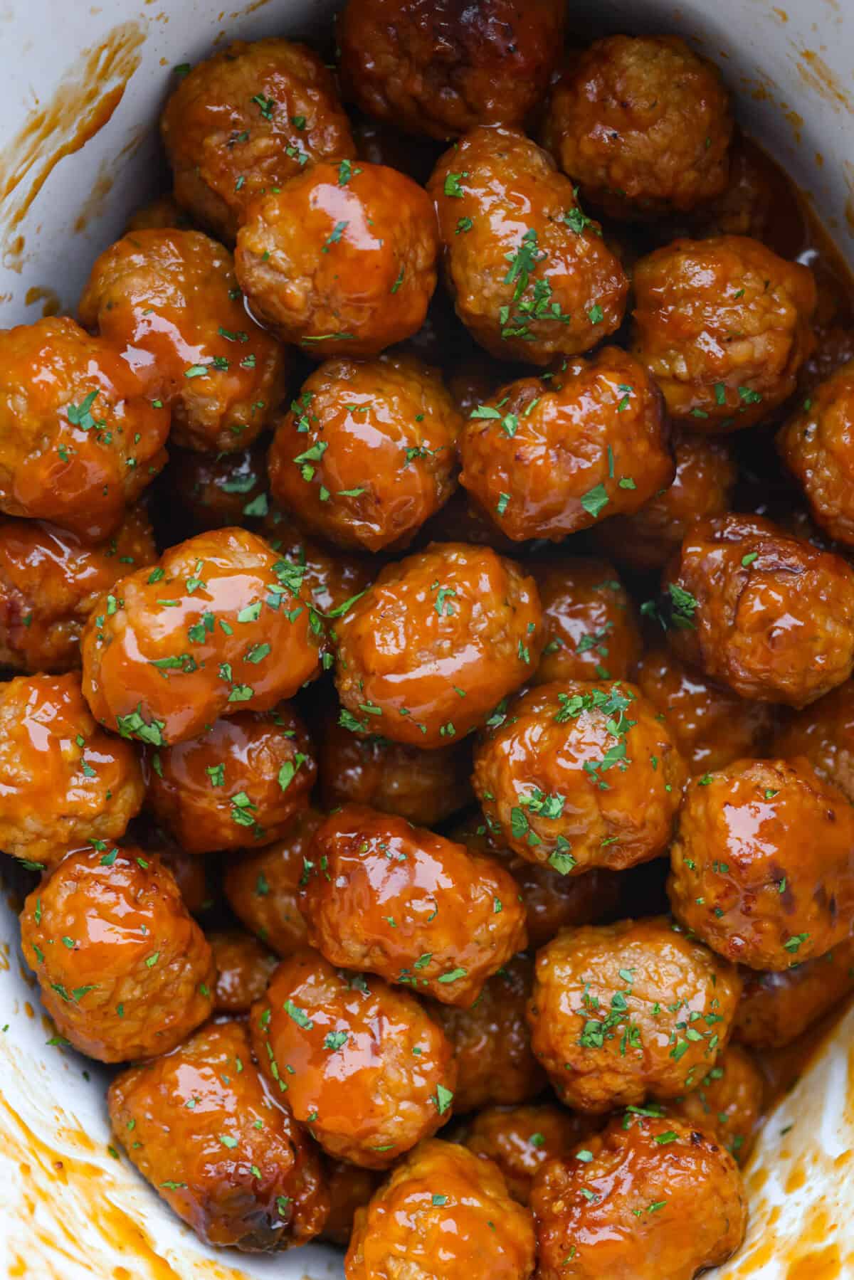 Overhead shot of slow cooker honey buffalo meatballs.