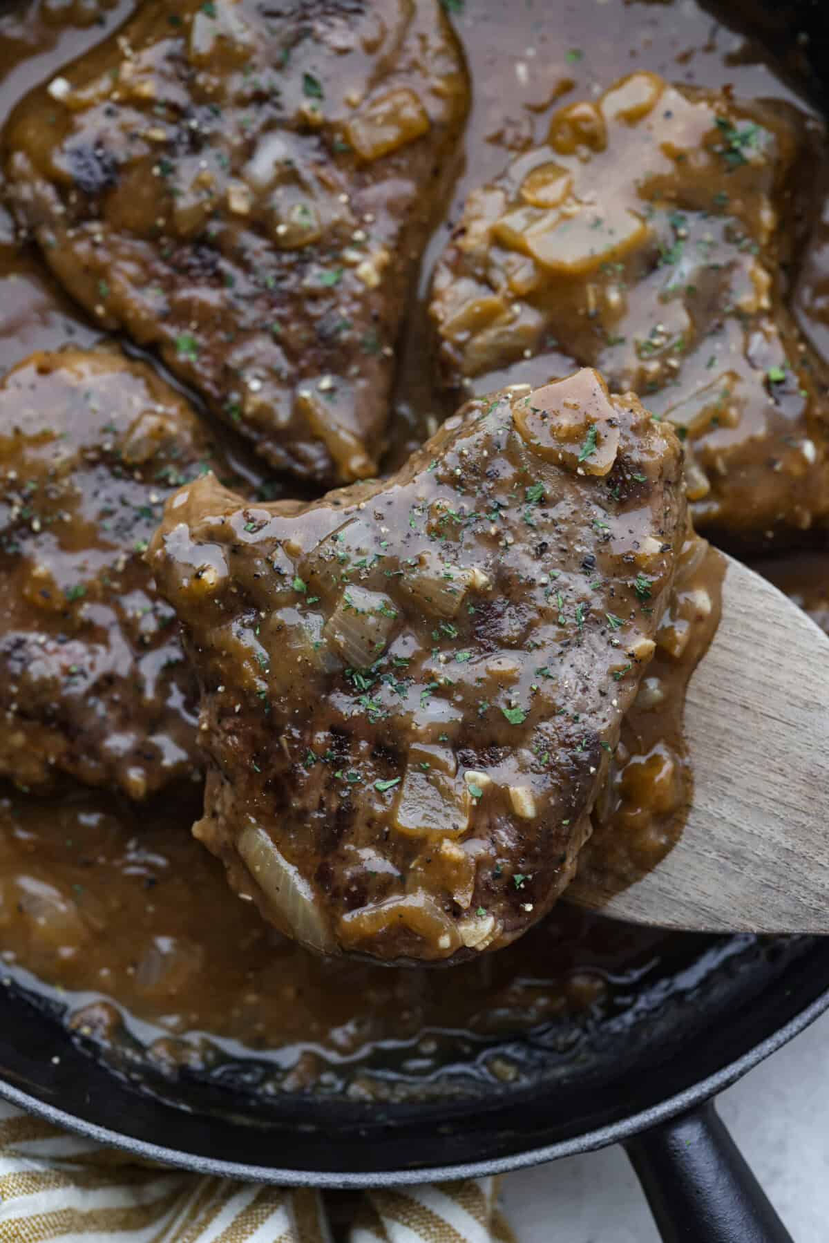 Close up shot of smothered steak. 