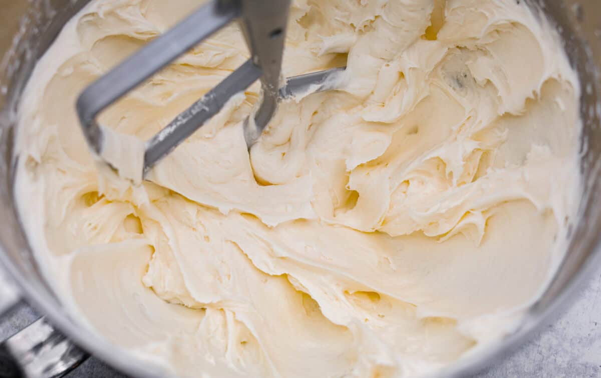 Overhead shot of the butter and sugar being beat in a mixing bowl. 