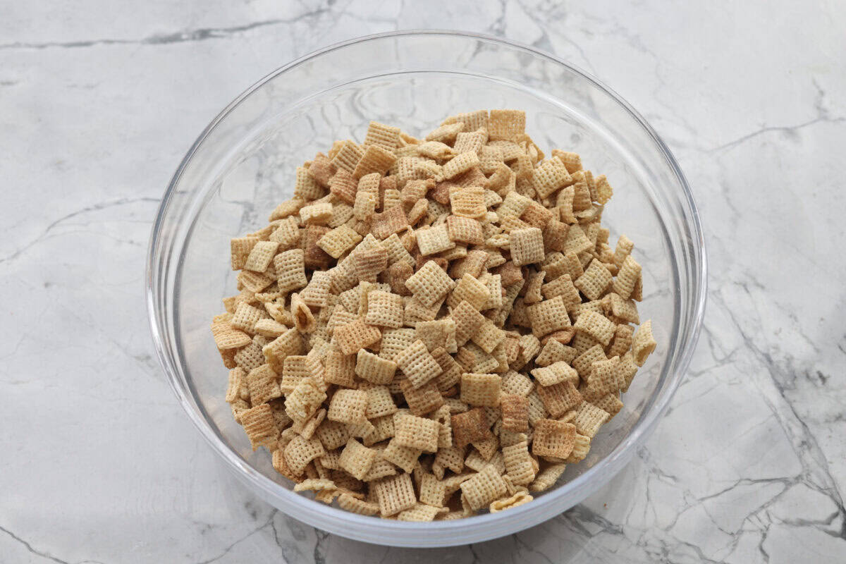 Overhead shot of cereals mixed together in a large bowl. 