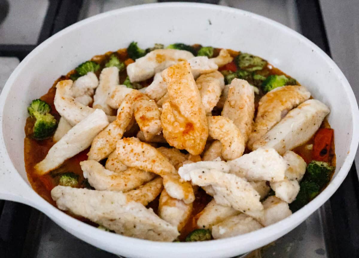 Fifth photo of the chicken stir fry and Hunan sauce combined in the skillet.