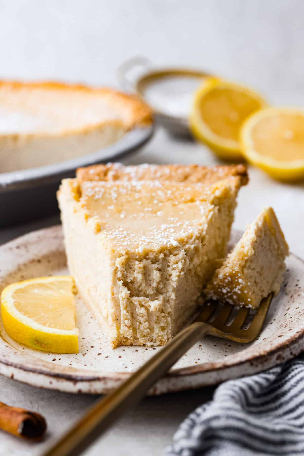 Close up shot of a plated piece of ricotta pie. 