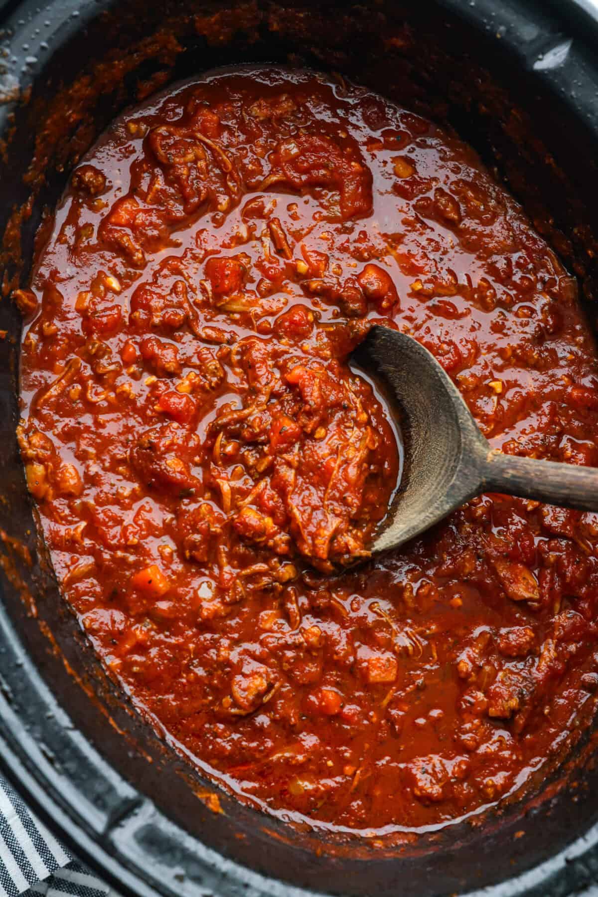 Overhead shot of slow cooker Sunday sauce in a crockpot. 