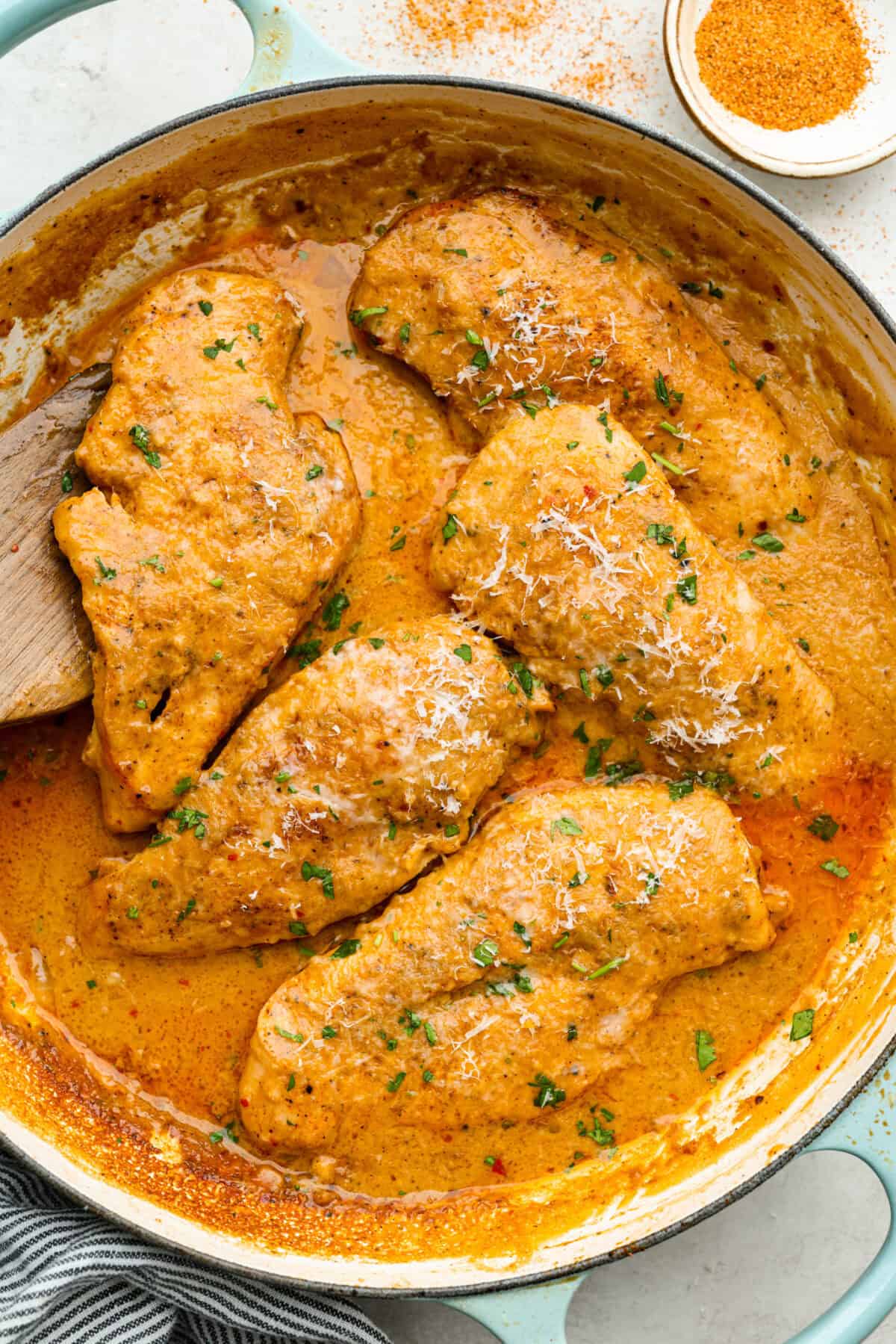 Creamy Cajun Chicken is the perfect combination of bold, zesty flavors and rich, velvety sauce. Juicy, tender chicken is coated in a perfectly spiced Cajun seasoning and simmered in a luscious, creamy sauce that’s packed with flavor. Overhead shot of creamy cajun chicken in a skillet.