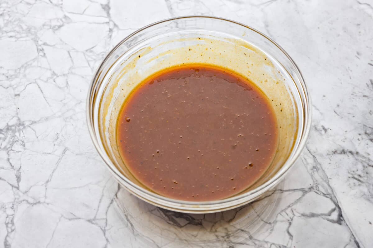 Overhead shot of sauce ingredients mixed together in a bowl. 